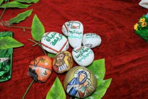 من أعماله بالرسم على الحجاره لمبادرة حياة كريمة 